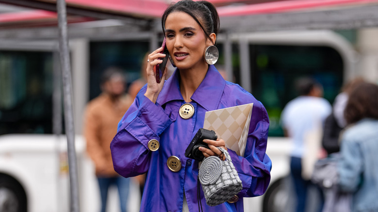 Woman wearing violet jacket