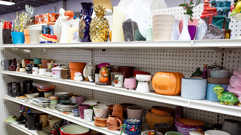 A household items thrift store with different sorts of merchandise of different sizes lined on the shelf