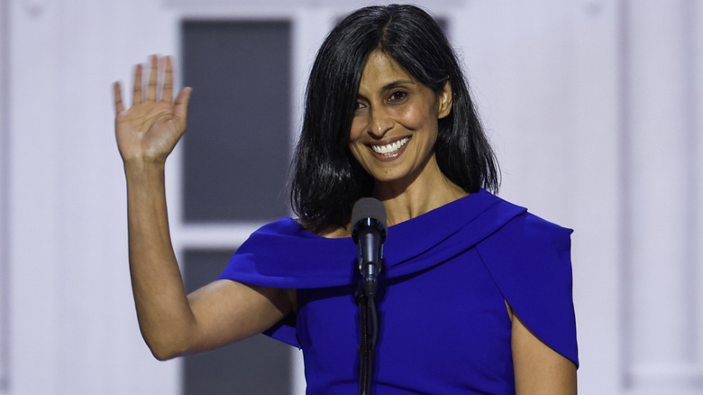 Usha Vance waving at a podium on stage