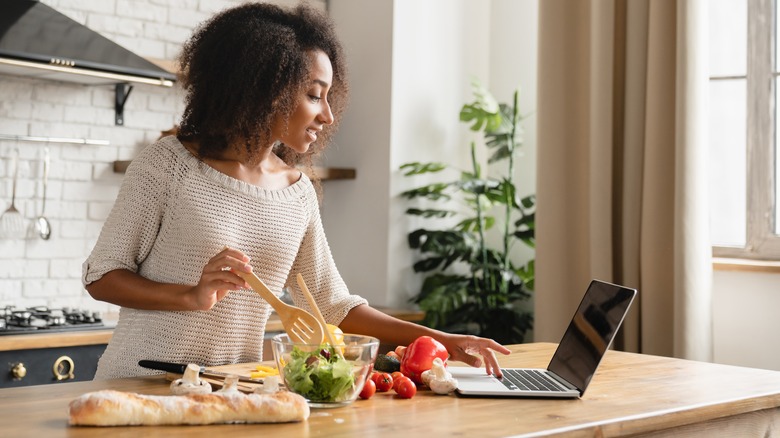 Woman following a digital recipe