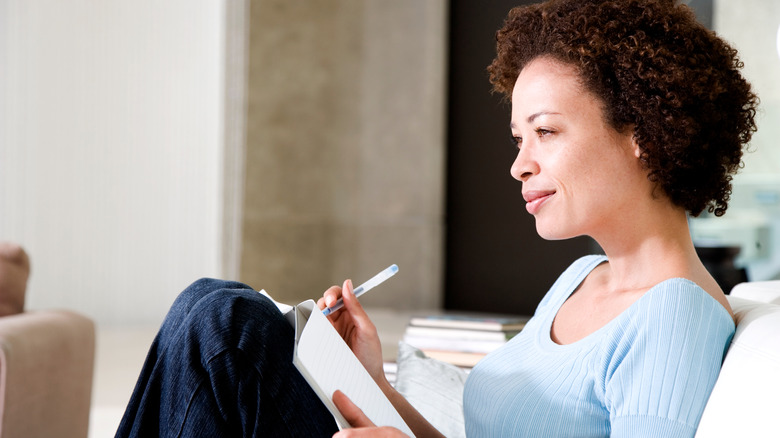 relaxed woman journaling