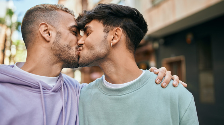 Couple kissing outside