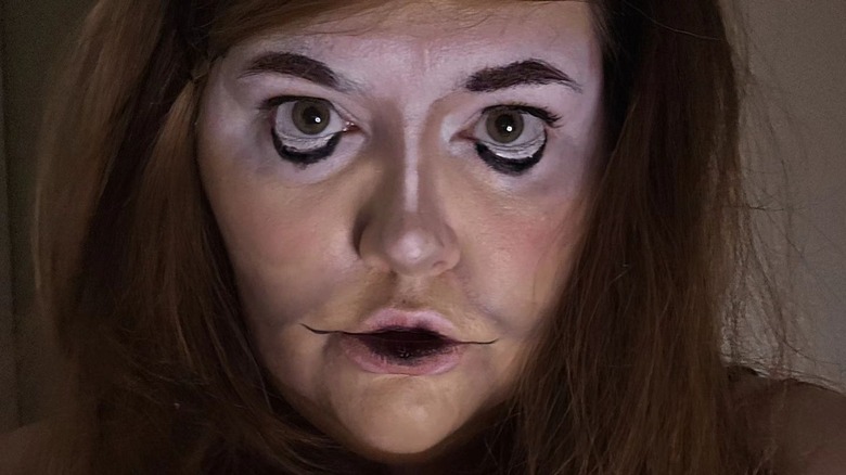 Uncanny valley makeup red hair