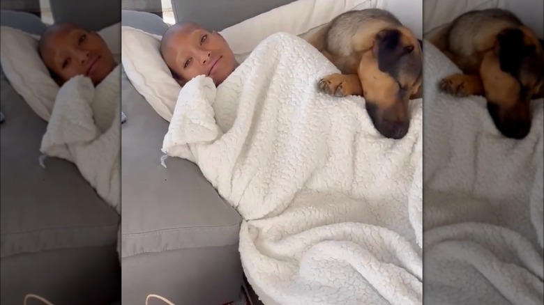 Willow Smith lying with dog