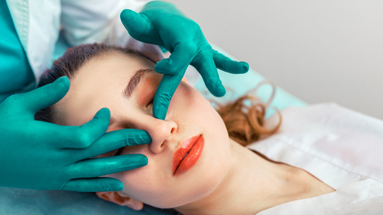 woman before having nose treatment