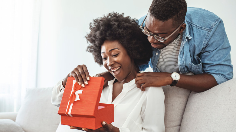 woman opening gift