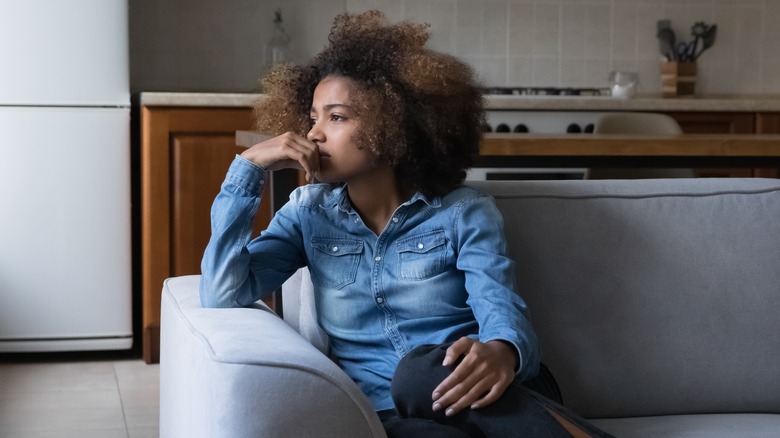woman sitting on couch