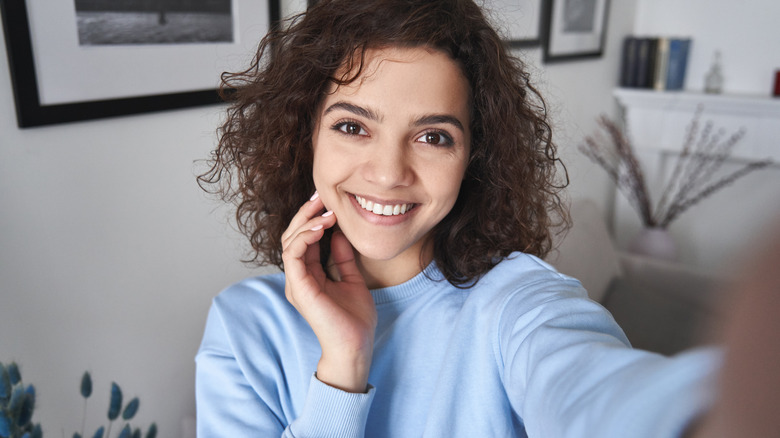 woman filing selfie video