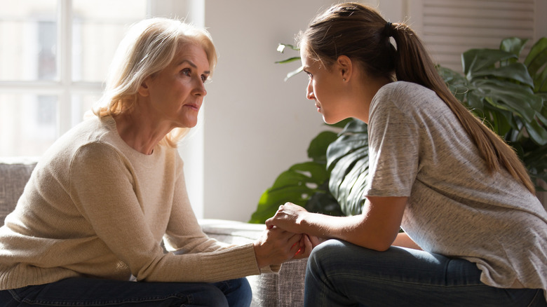 Mother and adult daughter talking