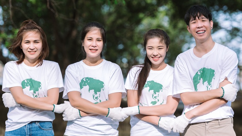 Volunteers holding hands
