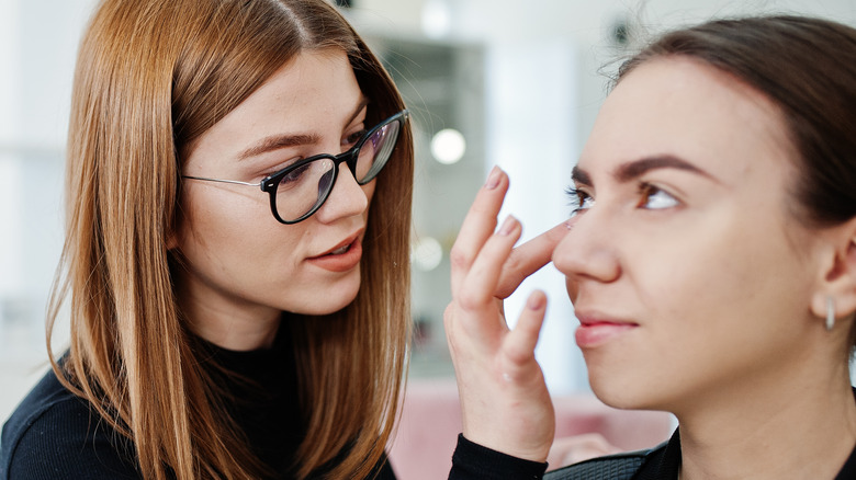makeup artist applying makeup