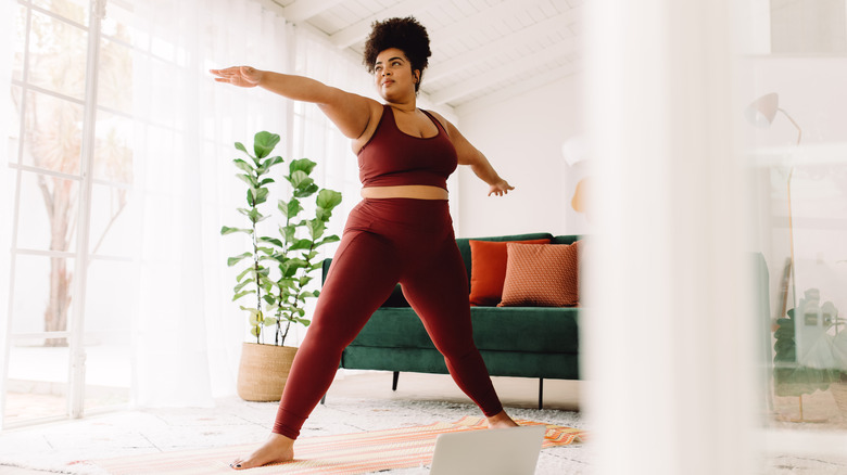 Woman doing yoga at home 
