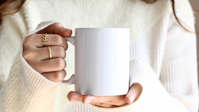 woman holding a mug