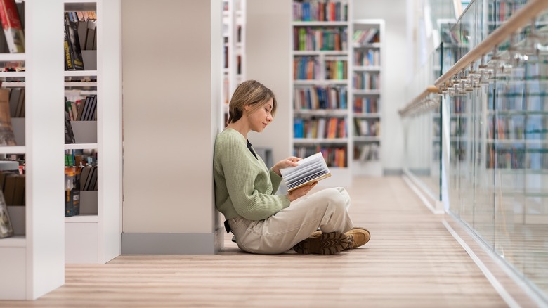 woman reading in library
