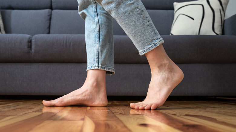 woman walking barefoot on floor