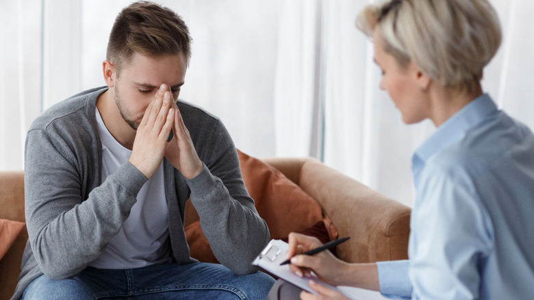 man at therapist office