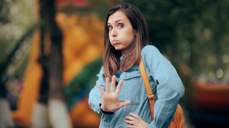 woman signaling stop
