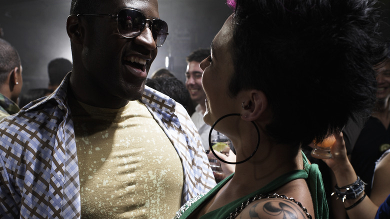 man and woman flirting