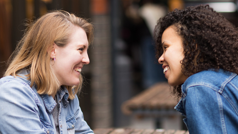 two women flirty eye contact