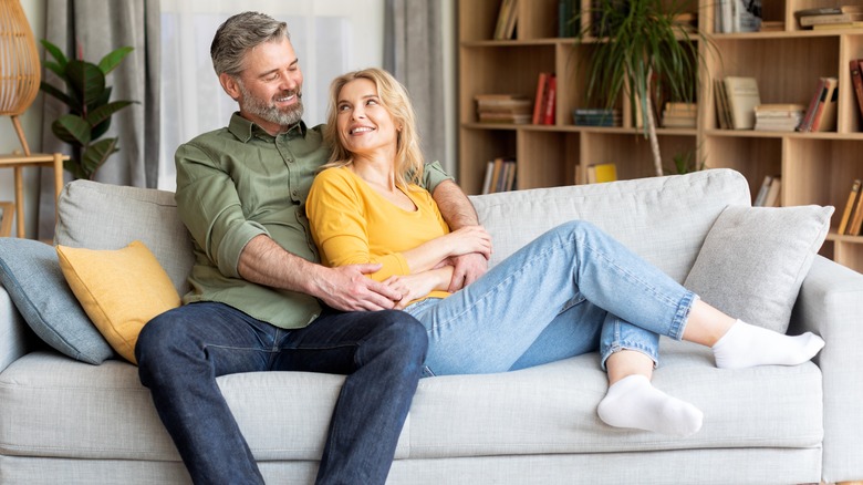 happy couple on couch