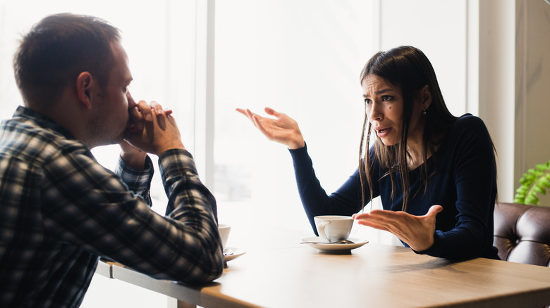sad couple at restaurant