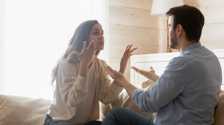 couple talking holding hands
