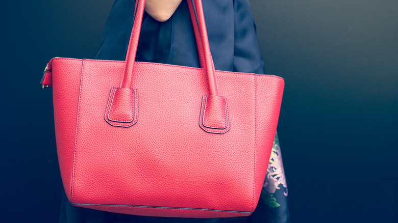 woman carrying a purse