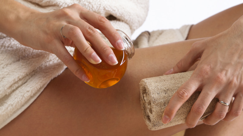 woman scrub her skin