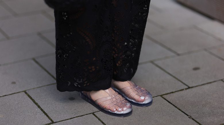 A close-up pair of jelly sandals