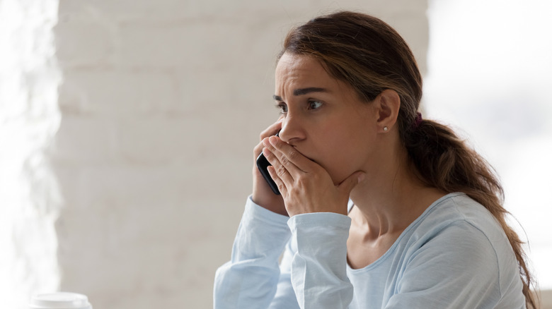 Upset woman on cell phone