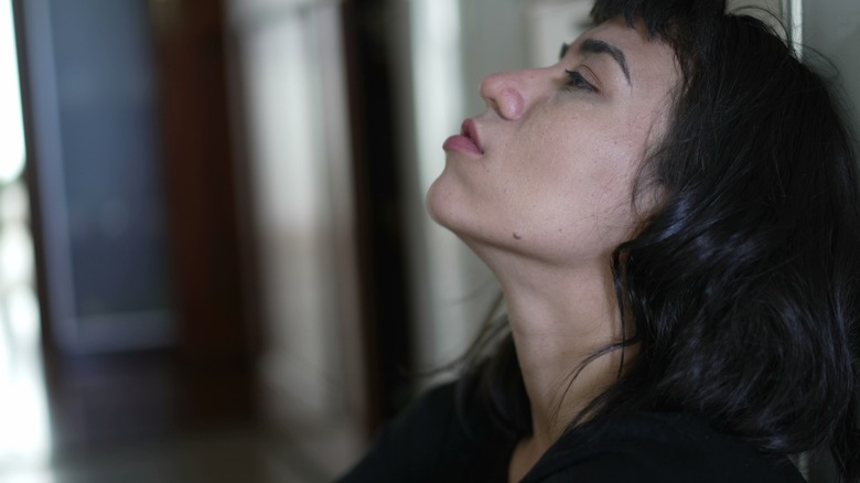 Woman exhaling a deep breath 