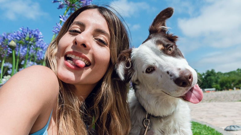woman and pup tongues out