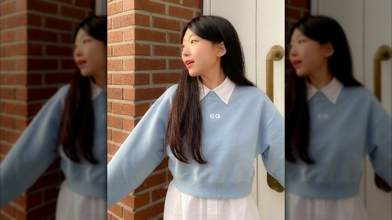 Woman wearing pastel blue sweater