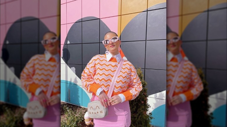 Woman wearing orange and pink