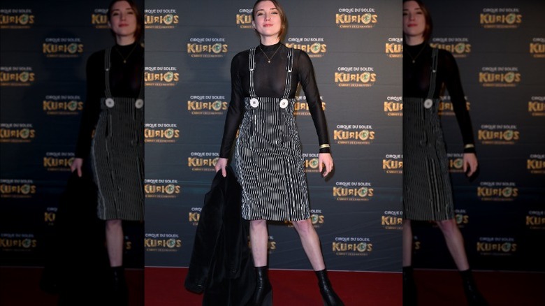 Woman wearing pinstriped pinafore