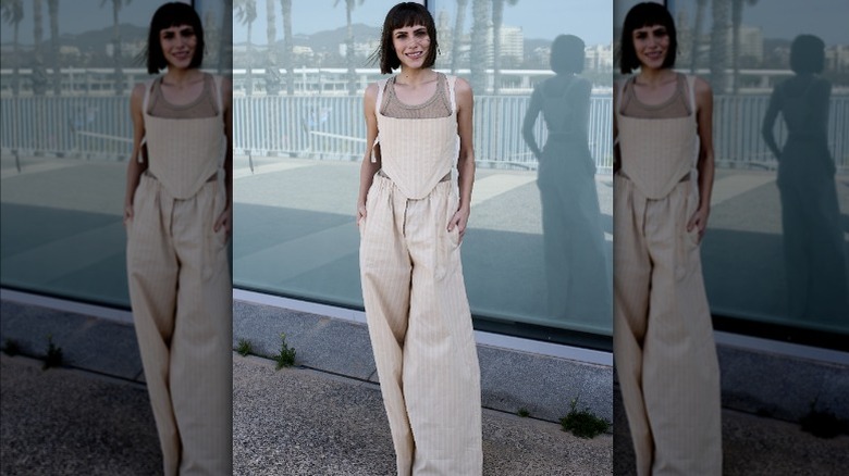 Woman wearing beige pinstriped outfit