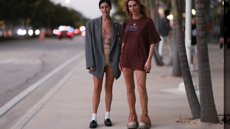 Woman wearing oversized pinstriped blazer