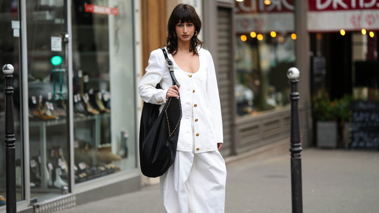 woman with a black large shoulder bag