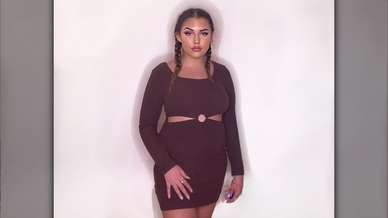 person wearing negative space dress