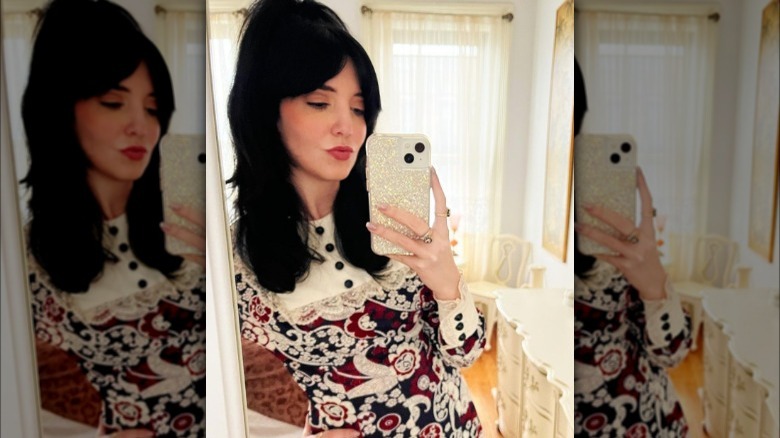 A woman with curtain bangs