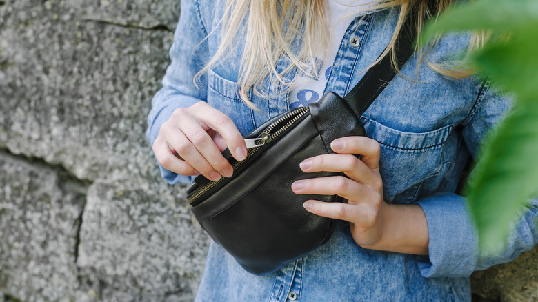 Woman wearing black fanny pack