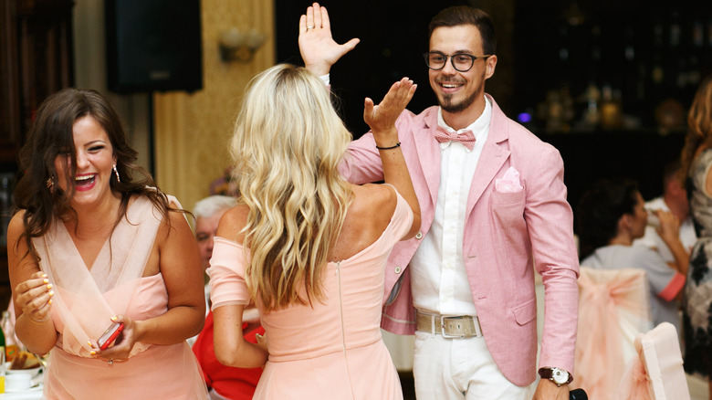Mixed gender bridal party in pink