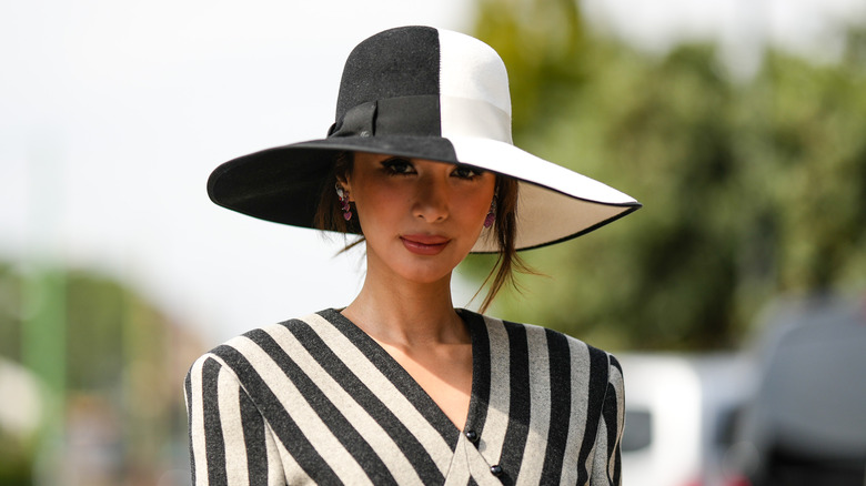 Heart Evangelista wearing black and white hat