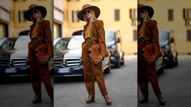 Woman wearing brown clothes and hat