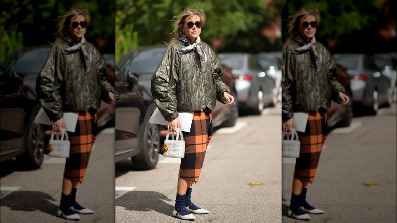 woman wearing white flats with socks