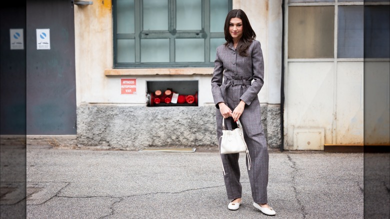 woman wearing white flats