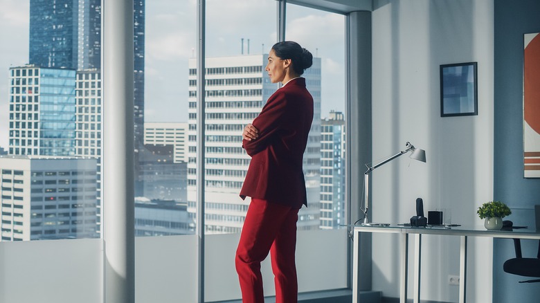 woman looking out office window