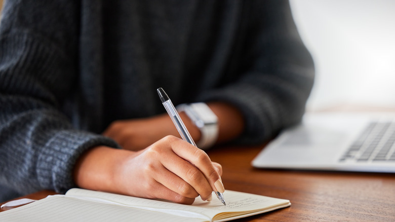 Woman writes in journal