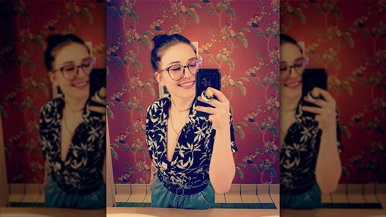 woman wearing tropical button-down