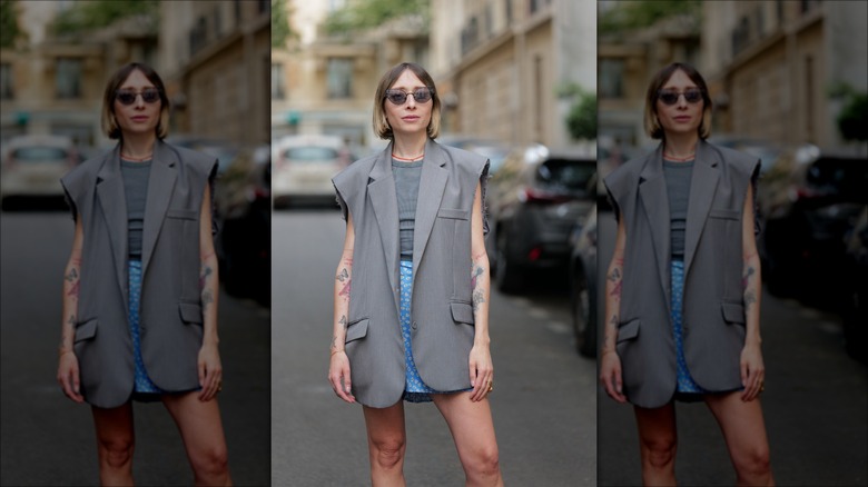 woman wearing sleeveless blazer vest